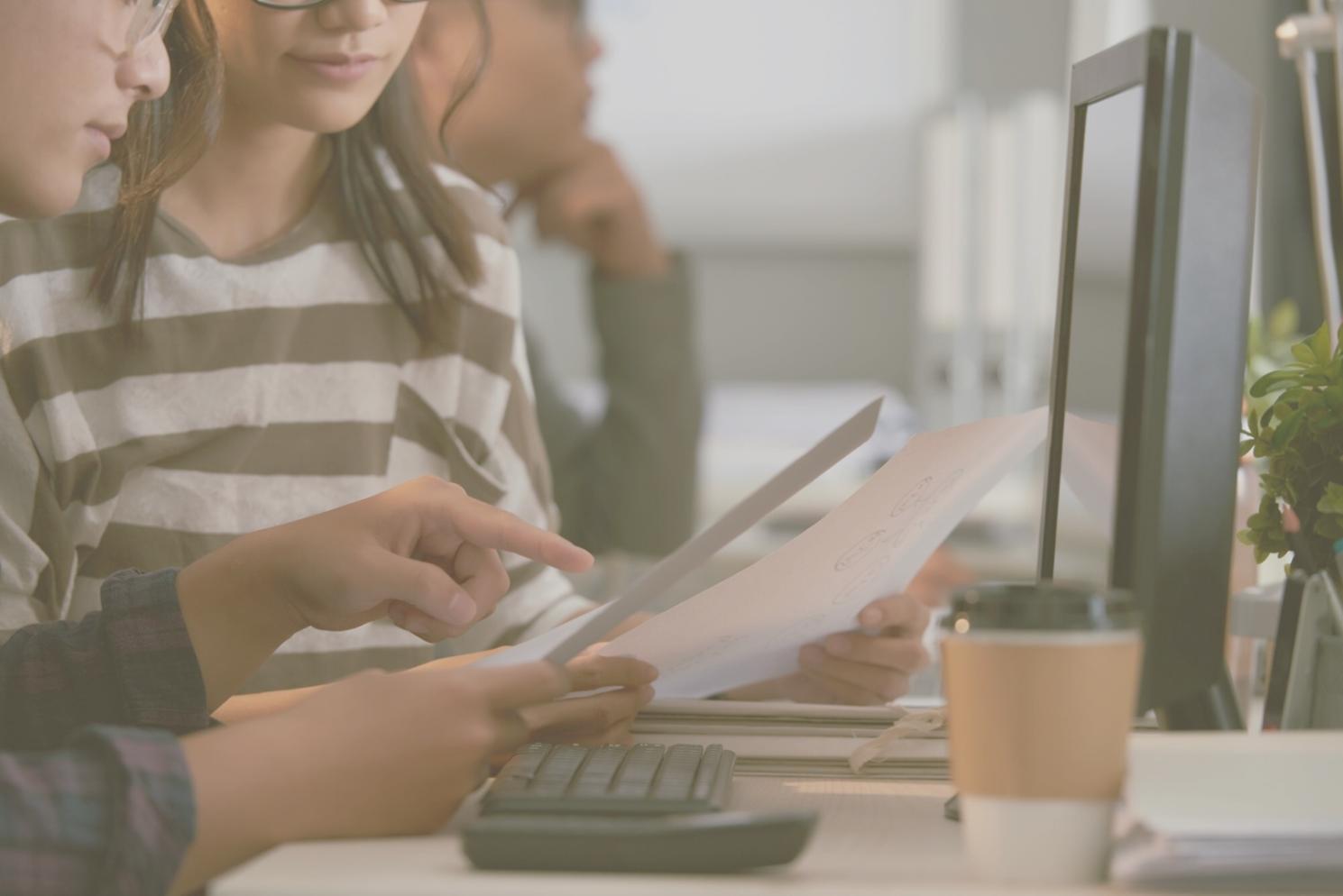 Professional financial consultation session showing goal tracking charts and progress documentation